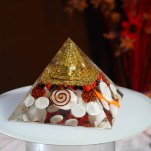 Natural Orgonite Laxmi Pyramid with Shri Yantra , Gomti Chakra , Rudraksha beads , White Kauri and Ratti seeds for Money and Spiritual Connection